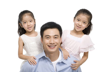 Fototapeta premium Portrait of father and two daughters