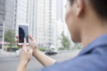 Young man using smart phone