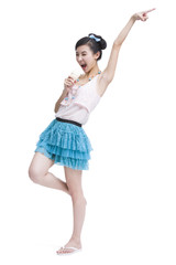 Excited young woman with ice cream cone singing