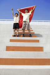 Father And Son Cheering With Chinese Flag