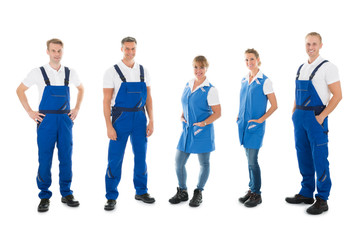 Fototapeta premium Portrait Of Confident Janitors Standing In Row