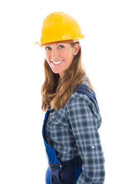 Portrait Of Smiling Female Worker Standing Arms Crossed