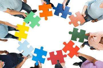 Creative Business Team Holding Colorful Jigsaw Pieces
