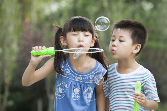 Two Children Blowing Bubbles