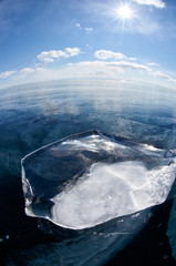 Fototapeta na wymiar Ice floe and sun on winter Baikal lake