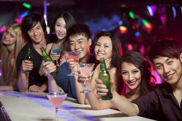 Stylish young people at bar counter