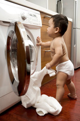 Infant with washing machine