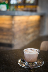 cup of hot cocoa on wood table