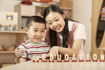 Teacher And Child With A Word Train