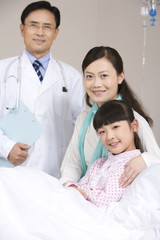 Obraz premium Portrait of a girl, her mother, and her doctor