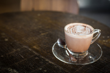 cup of hot cocoa on wood table