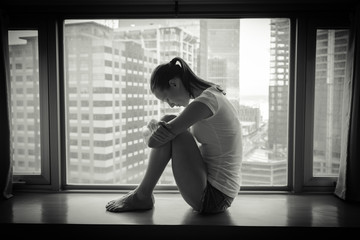 Unhappy woman in the city.
