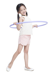 Happy girl spinning plastic hoop
