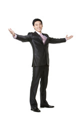 Full length of businessman with arms outstretched