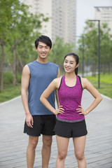 Fototapeta premium Young couple taking a break from exercise