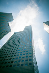 Obraz na płótnie Canvas Skyscraper building at singapore - blue whitebalance and green p