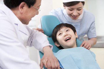 Fototapeta premium Little patient receiving treatment in dental clinic