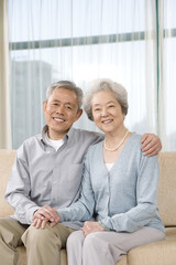 Elderly couple on couch