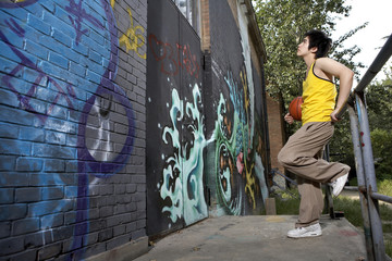 Teenage Boy  Looking At Spray Painted Wall