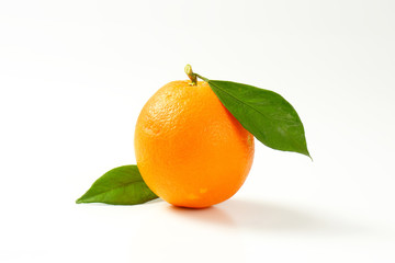 Whole orange with leaves