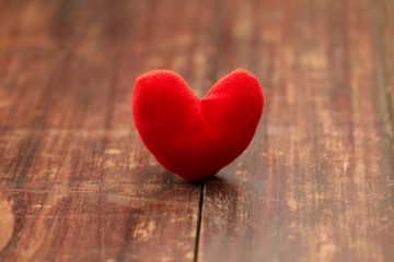 red heart on a wooden table. Background Valentine's day