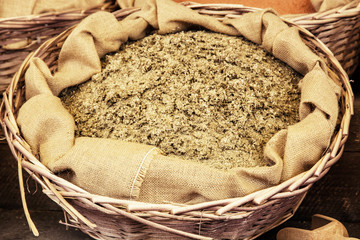 Dried ground fenugreek in the wicker basket