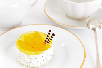 Sweets: Cream Cakes on Plate.