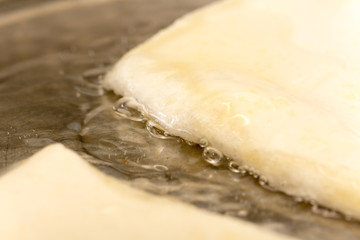 Frying puff pastry in hot oil