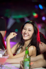 Stylish young people at bar counter