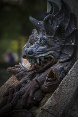 Fototapeta na wymiar devil figure, bronze sculpture with demonic gargoyles and monste