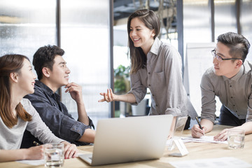 Business people having meeting in board room