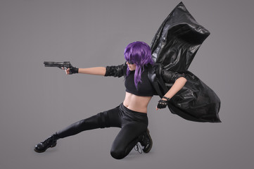 Woman with gun / Portrait of sexy woman posing in studio with gun