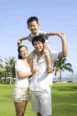 Portrait of a young family in a tropical location