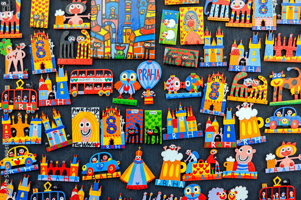 Wall mural Traditional wooden colorful souvenir magnets on display in Prague, Czech Republic