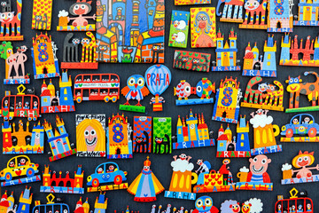 Traditional wooden colorful souvenir magnets on display in Prague, Czech Republic