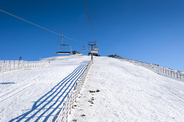Chair lift in Navacerrada Ski Resort, Navacerrada Mountain Pass, Madrid, Spain, on January 4, 2015.
