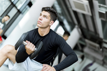 Young man training in a gym