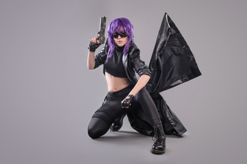 Woman with gun / Portrait of sexy woman posing in studio with gun