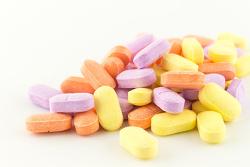 Obraz na płótnie Canvas colorful antibiotic tablets on white