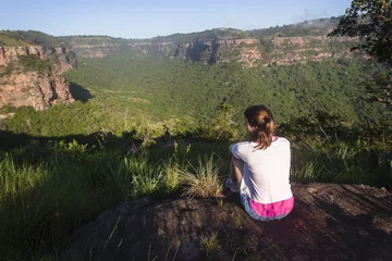 Foto op Canvas Girl Hiking Wilderness overlooking rural valley landscape summer. © ChrisVanLennepPhoto