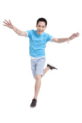 Excited young man jumping in mid air