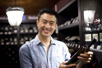 Young man shopping in cellar