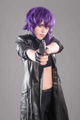 Woman with gun / Portrait of sexy woman posing in studio with gun