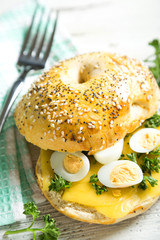 Bagels with cheese and quail eggs