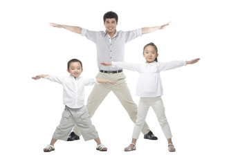 Father and children arms outstretched