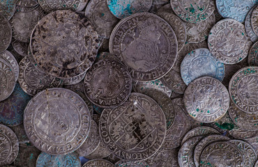 trove of ancient medieval coins silver background