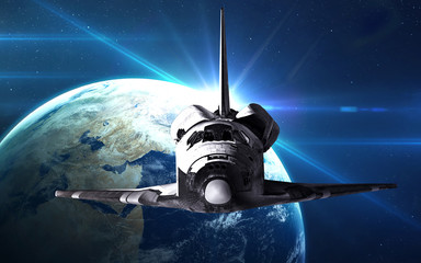 Fototapeta na wymiar Space shuttle taking off on a mission. Elements of this image furnished by NASA