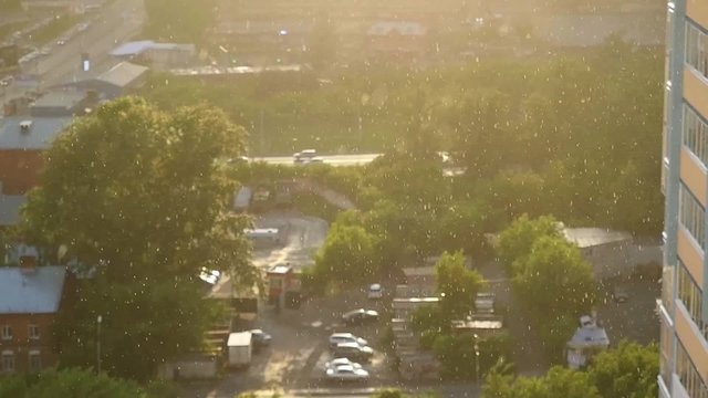 It's rainy on a background of the city at sunset in slowmotion