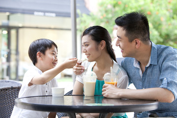 Family enjoying cold drink together