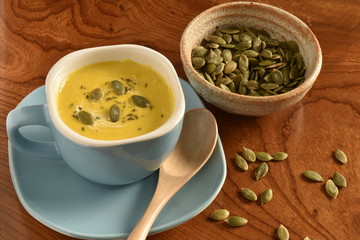 Pumpkin soup in a blue bowl